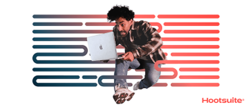 Man holding a laptop midair 